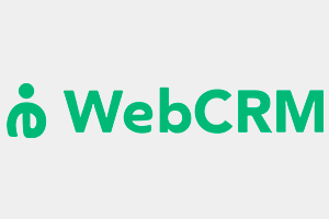 WebCRM_300x200px Telefon abonnement til erhverv kundeservice medarbejder med headset foran computer